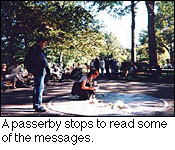 A passerby stops to read some of the messages.